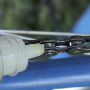 Bicycle chain cleaning - lubricate the chain one link at a time.