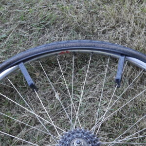 Bicycle flat repair - emoving the tire from the rim with tire levers.